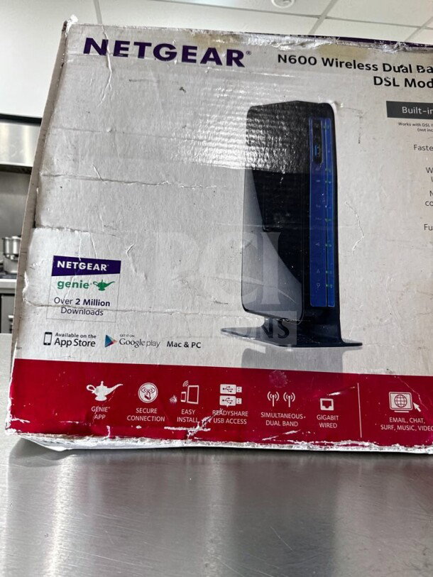 Netgear DGND3700-100NAS N600 Wireless Dual Band Gigabit ADSL2+ Modem Router, brand new in box. Box shows some wear.