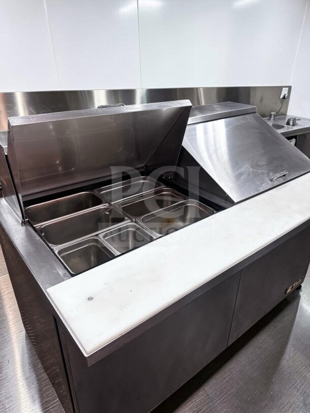 True TSSU-60-24M-B-ST-HC 60" mega top prep table in superior condition, holds 24 pans, 115V, fully tested.