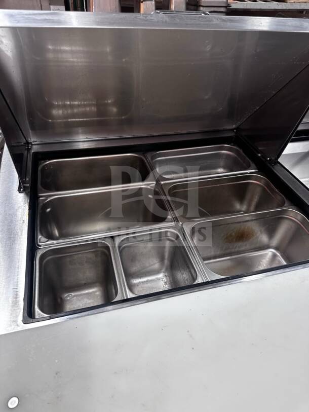 True TSSU-60-24M-B-ST-HC refrigerated prep table, 24-pan capacity, stainless steel, excellent condition, fully operational.