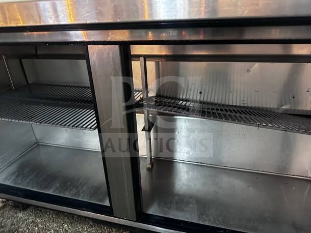 True TSSU-60-24M-B-ST-HC Mega Top Refrigerated Prep Table, 60", 24-pan capacity, superior condition, stainless steel interior.