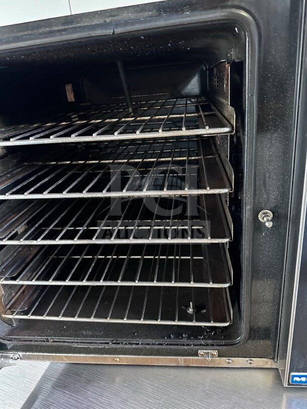 Moffat Turbofan E32D5 convection oven, prime condition, clean interior, multiple wire racks, NSF & ETL listed, 208V.