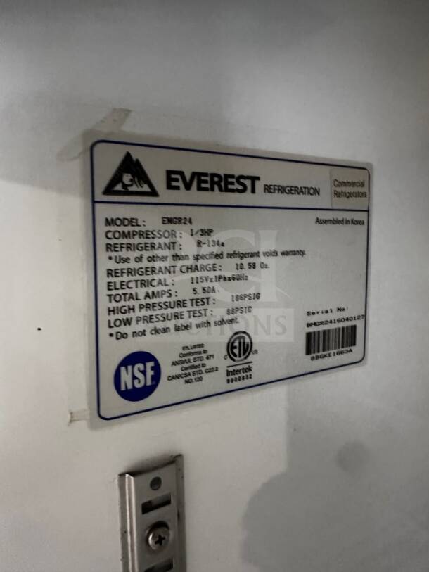 Label on Everest EMGR24B refrigerator showing model, compressor, refrigerant, electrical specs, NSF and ETL listings.
