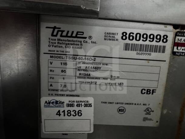 Alt text: True TSSU-60-16D-2 refrigerant label showing model details and certification marks.