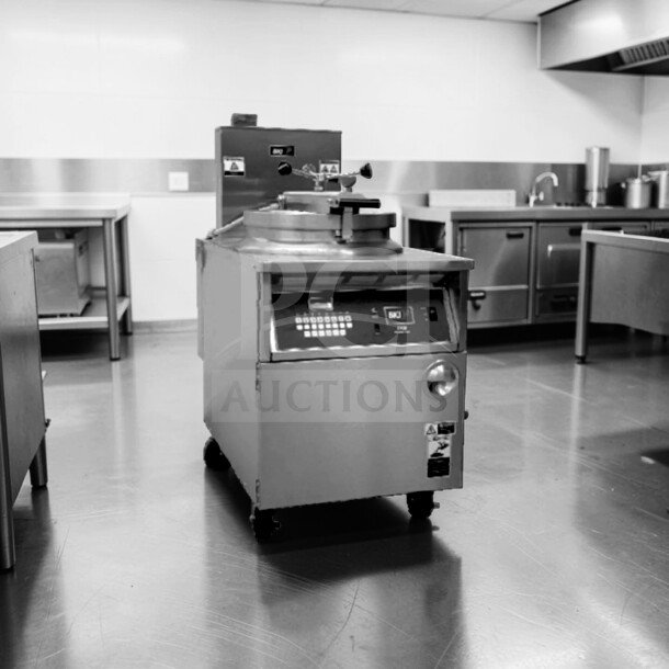 BKI FKG-FC commercial gas pressure fryer, 24" wide, 18 lb capacity, stainless steel, prime condition, fully tested, 70,000 BTU.