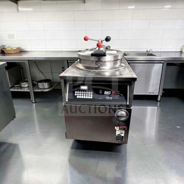 BKI FKG-FC Commercial Gas Pressure Fryer, 24" wide, 18 lb capacity, 70,000 BTU, stainless steel, prime condition, fully tested.