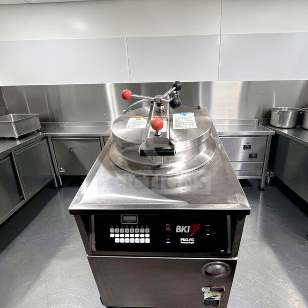 Prime Condition BKI FKG-FC gas pressure fryer, 24" wide, 18 lb capacity, 70,000 BTU, stainless steel, fully tested, operational.
