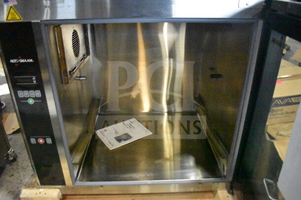Brand new Alto Shaam AR-7EVH rotisserie oven, electric-powered, 208V, 3 phase, scratch and dent condition, visible manual.