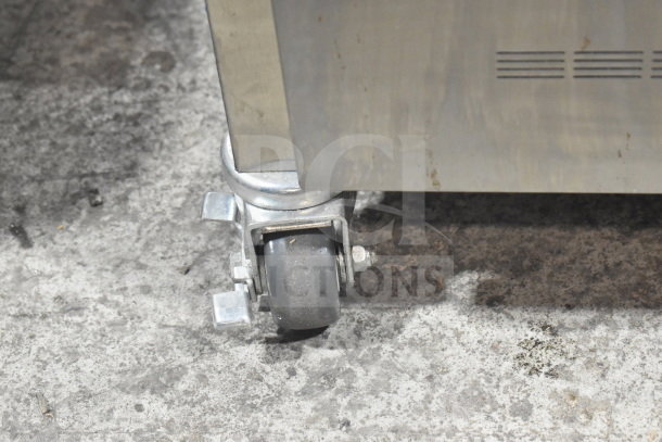 Commercial quality caster on Alto Shaam 750-S holding cabinet, stainless steel finish, new with minor scratches.