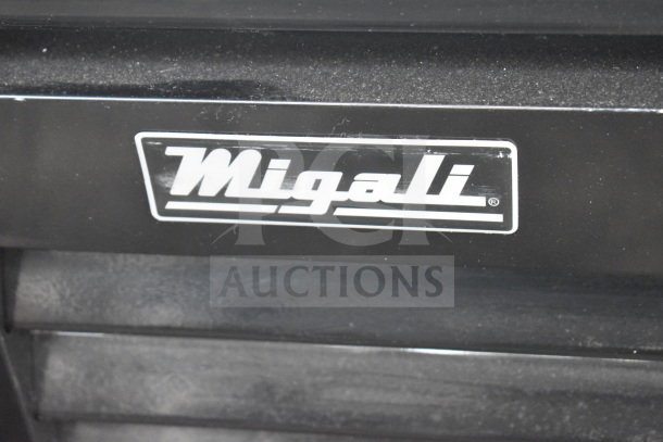 "Close-up of Migali logo on the 2022 Migali C-49FM-HCe Commercial Reach-In Freezer. Brand new condition with commercial casters."