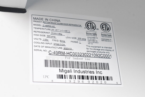 "Label from a new Migali C-49RM-HC cooler showing model, serial number, voltage, and refrigerant details. Made in China."