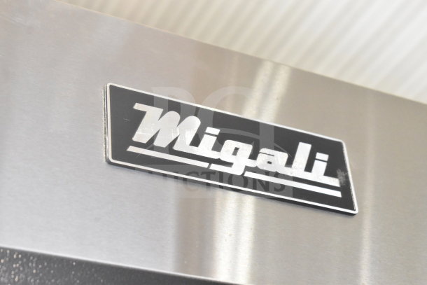 Migali logo on a stainless steel surface of the 2017 C-3R-HC Commercial 3 Door Reach In Cooler.