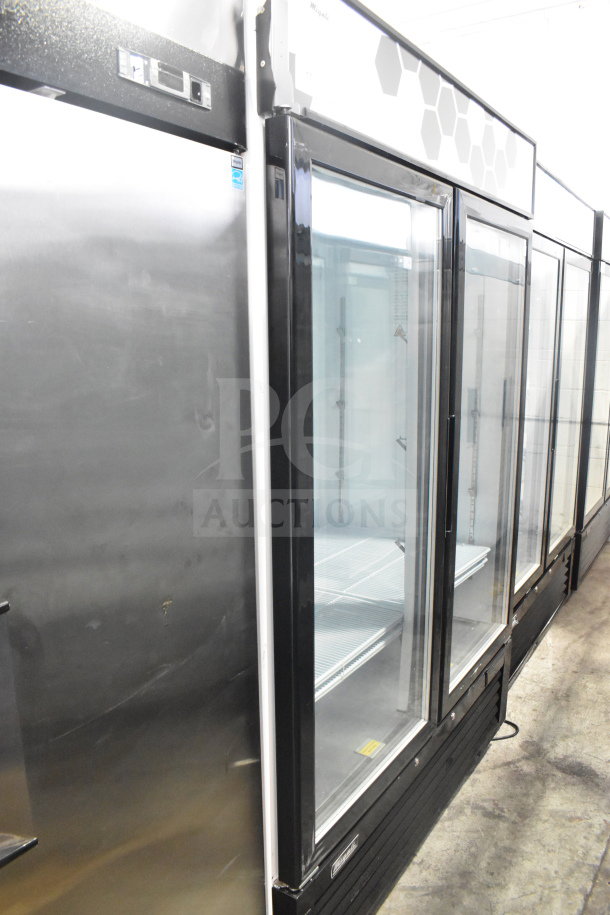 Migali C-49FM-HCe 3-door commercial freezer merchandiser, scratch and dent, on casters. 115V, 1 Phase.