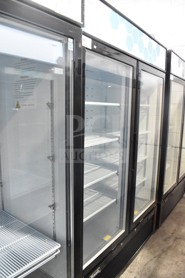 Brand new Migali C-49RM-HC commercial 3-door reach-in cooler merchandiser, scratch and dent, on casters, 115V, 1 phase.