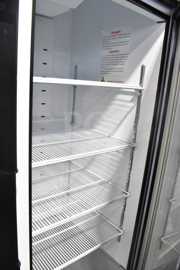 BRAND NEW 2022 Migali C-49RM-HC 3 Door Reach In Cooler with casters. 115V, 1 Phase. Shelving and safety label visible.