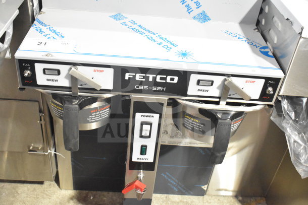 Brand new Fetco CBS-52H15 twin coffee brewer, 120/208-240V, 1 phase, labeled controls, minor scratches, full brew options.