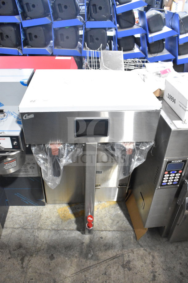 Brand new Curtis G4TP2T10A3500 coffee brewer, twin 1.5-gallon capacity, 220 volts, visible minor scratches.