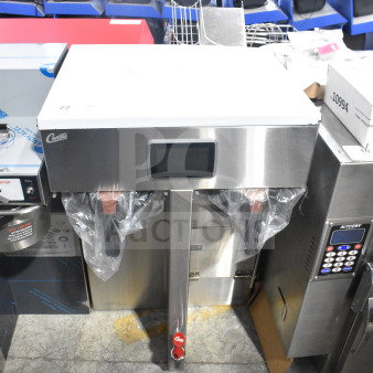 Brand new Curtis G4TP2T10A3500 coffee brewer, twin 1.5-gallon capacity, 220 volts, visible minor scratches.