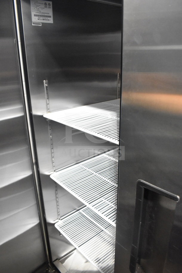 Migali C-3R-HC commercial 3-door cooler, brand new with minor scratches. Features shelves, serial C-3R-HC00318040200920009.