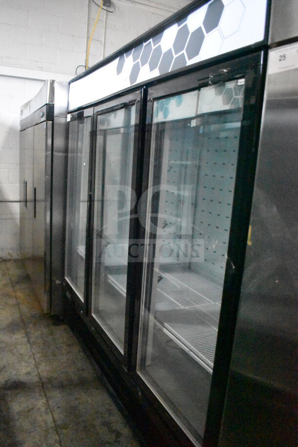 Brand new 2022 Migali C-72FM-HC commercial 3-door reach-in cooler with minor dents, on casters, 115V, serial C-72FM-HC003220304092C0007.