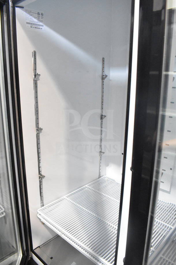 Brand new Migali C-72FM-HC 3 Door Reach In Cooler, commercial casters, serial C-72FM-HC003220304092C0007.