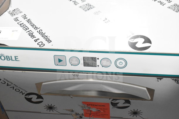 Brand new 2025 Noble 495LTUC24 undercounter dishwasher, low-temp, 120V, 1 phase, minor scratches, digital display visible.