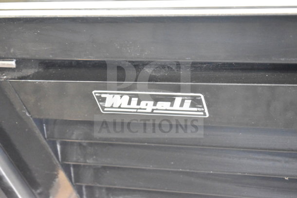 Migali logo on black surface of C-49FM-HCe commercial reach-in freezer merchandiser, brand new condition.