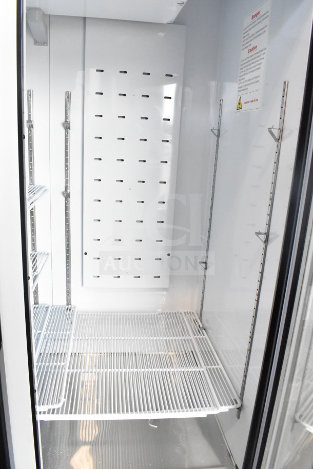 2019 Migali C-49FM-HCe reach-in freezer, pristine interior, adjustable shelving, commercial casters, 115V, 1 phase, model C-49FM-HC.
