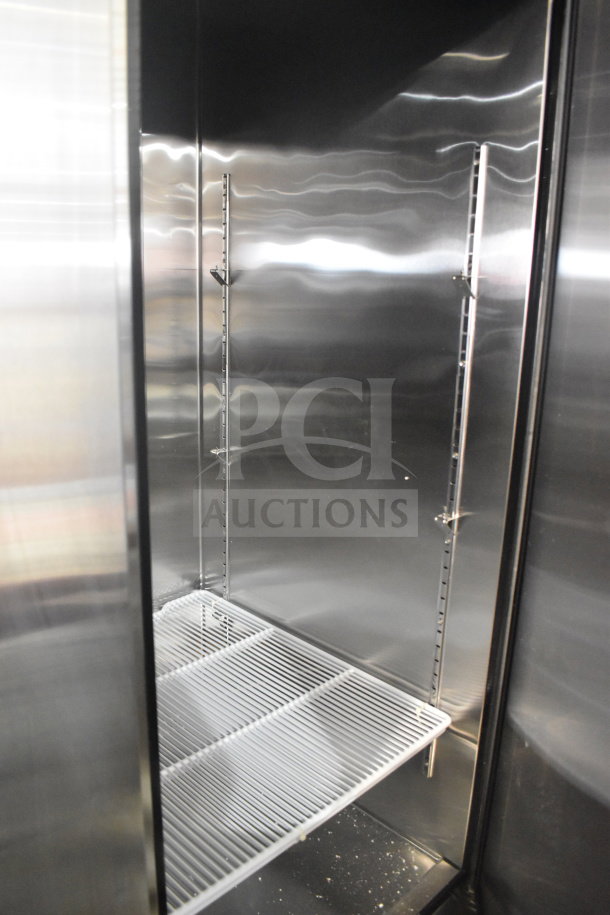 2023 Migali C-3FB-HC Commercial 3 Door Freezer interior, stainless steel, adjustable shelving, on casters. 115 Volts, 1 Phase.