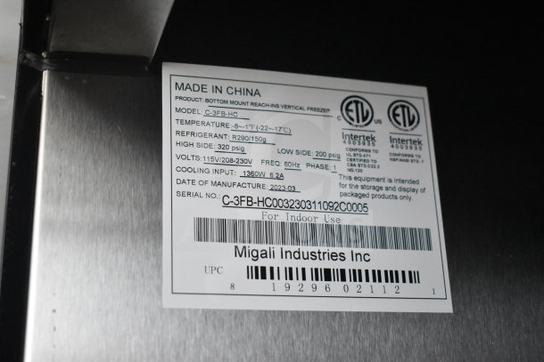 "Label on Migali C-3FB-HC commercial freezer showing model, serial number, voltage, and cooling specifications."