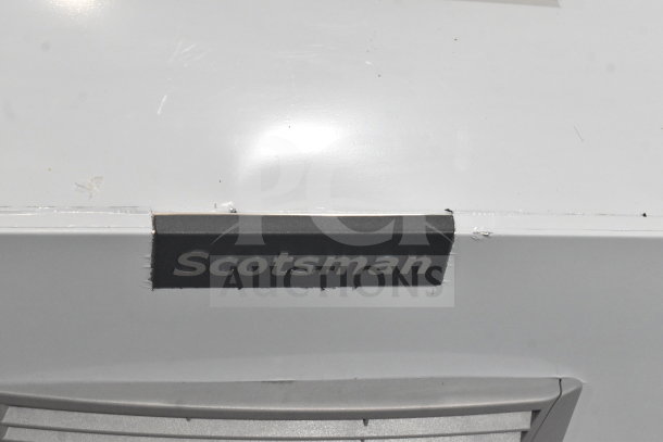 Brand new Scotsman MC0330MAX-1A commercial ice machine, scratch and dent condition, visible Scotsman logo, white exterior.