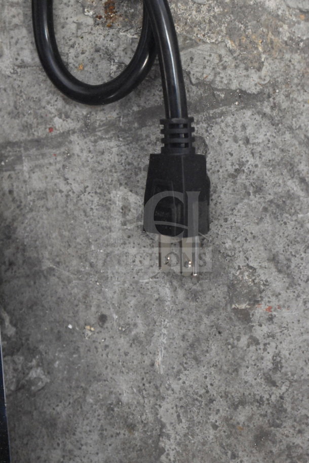 Carnival King 382PMW17R power cord against a concrete surface. 110 Volts, 1 Phase. Brand new, missing glass pane.