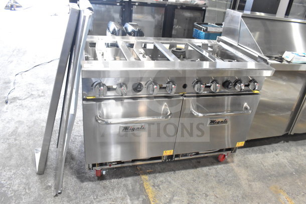 Brand new Migali C-RO8B-NG 8 burner range with 2 ovens, commercial casters, slight scratch and dent. Serial C-RO8B-NGP19004.