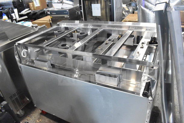 Brand new Migali C-RO8B-NG commercial 8 burner range, scratch and dent, with 2 ovens on casters, serial C-RO8B-NGP19004.