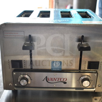 Brand new Avantco countertop 4-slot toaster, 120V, 1 Phase, with minor scratches. Features adjustable knobs and control levers.