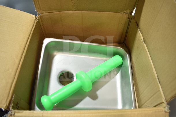Alt text: "Brand new 190M22HGA Meat Grinder Attachment with green stomper for #22 hub in box. Stainless steel finish, minor cosmetic dent."