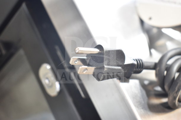 BRAND NEW scratch and dent warming lamp plug, 120 volts, 1 phase, coiled cord visible, minor cosmetic wear.