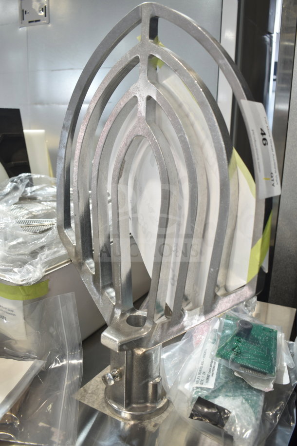 BRAND NEW Hobart 00-874654 Beater Paddle, HP00874654, stainless steel, scratch and dent, auction tag visible.