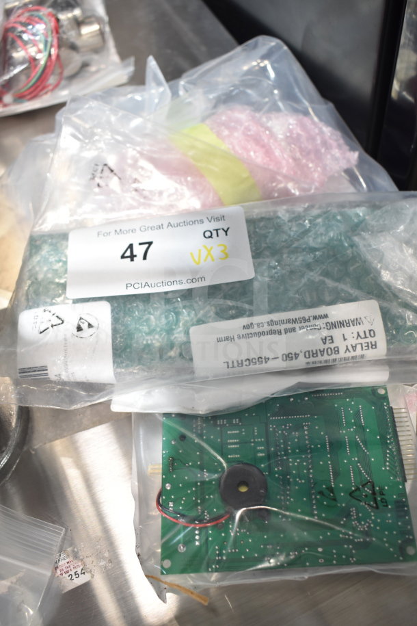 3 brand new Garland/US Range electronics in bags: Interface Board Elreha 4527483, Relay Board 4527484, PCB 300867. Marked "QTY VX3".