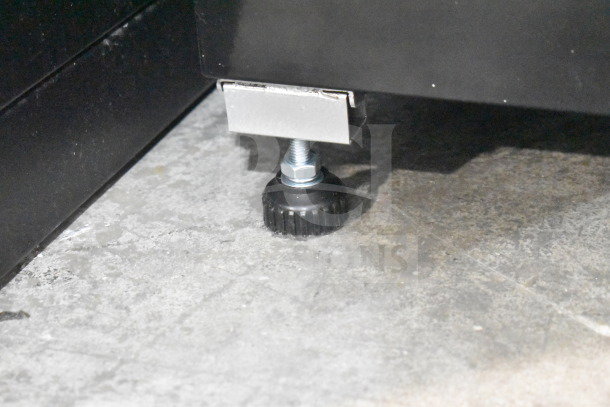 Brand new KoolMore commercial merchandiser, single door, 110-120V, 1 Phase, showing adjustable leveling foot.