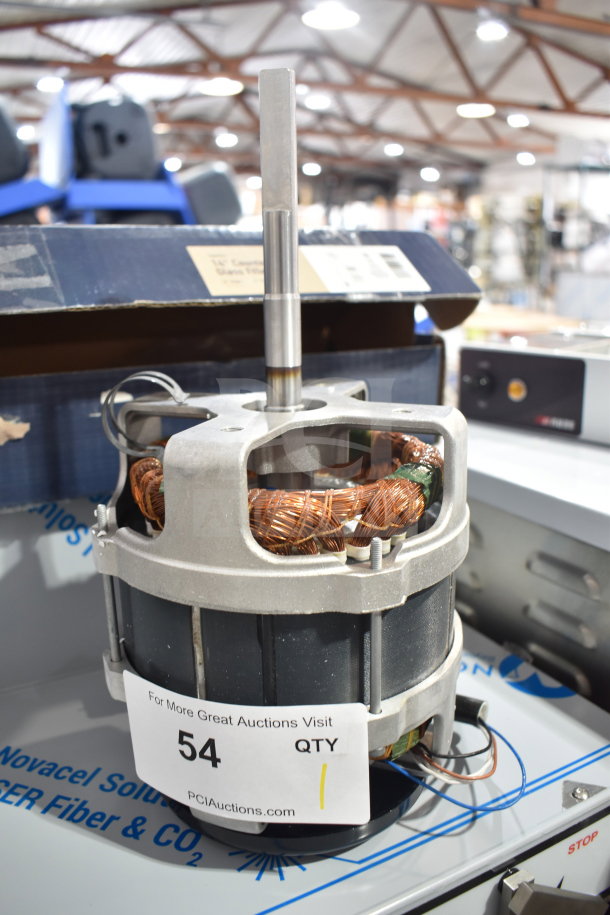 BRAND NEW Nidec Motor, 120 Volts, 1 Phase. Scratch and dent condition. Auction lot tag visible.
