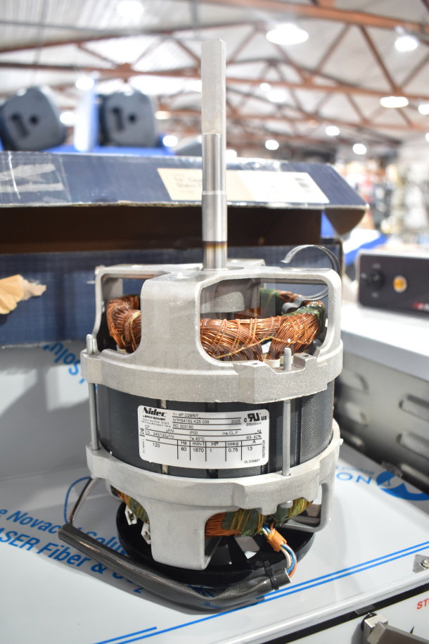 Brand new Nidec motor, 120 volts, 1 phase. Scratch and dent. Visible label with model and specs.
