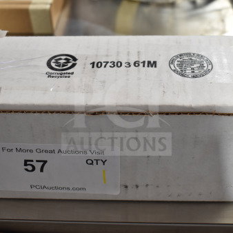 Box containing brand new Heatcraft 25317801 evaporator motor with minor scratches. Label shows auction and recycling info.