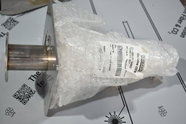 Brand new Vulcan 00-858579-00002 burner head assembly, labeled genuine OEM, wrapped in bubble wrap.