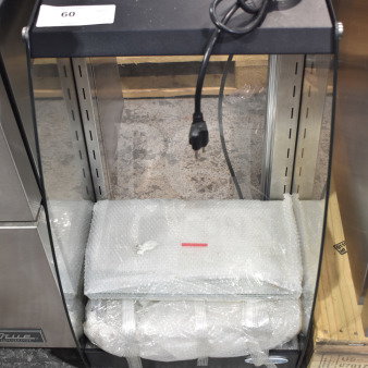 BRAND NEW KoolMore DC-3CB Commercial Glass Bakery Display Case, 2.7 cu. ft., with bubble-wrapped components placed inside.