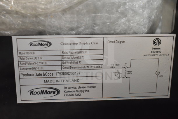 KoolMore DC-3CB display case label, shows specs including 2.7 cu. ft. capacity, 110-120V, LED lighting, made in Thailand.
