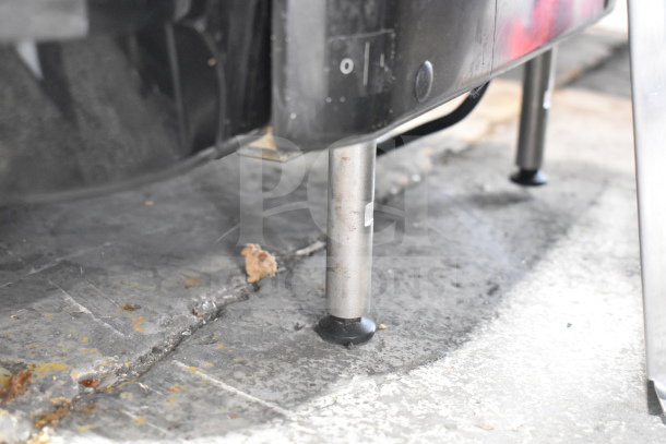 Close-up of the base and legs of a Narvon 378NSSM2 frozen beverage machine, showing surface scratches.