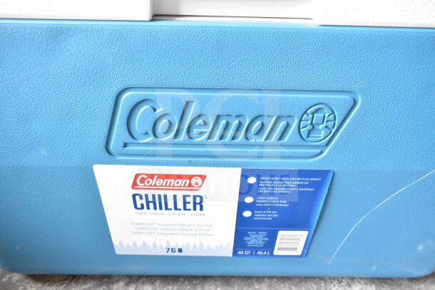 Three Coleman portable coolers; two blue, one red. Features 76-quart capacity, TempLock insulation, made in USA.
