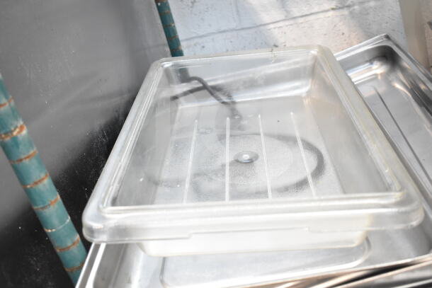 Lot of various kitchen items including footed plates and chafer lids. Visible condition is used, showing some wear.