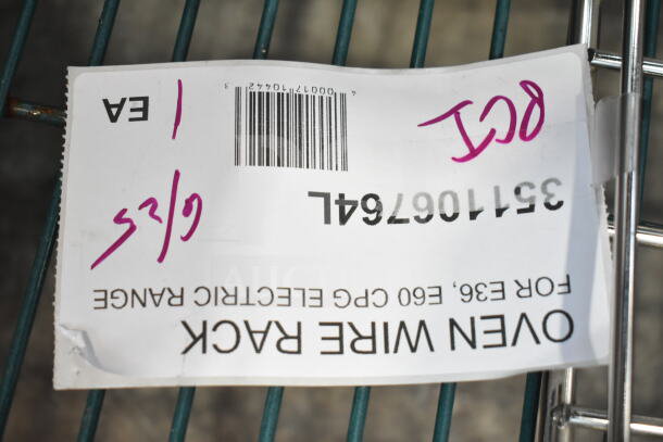 "ALL ONE MONEY" lot tag showing barcode, with handwritten numbers on oven wire rack for E36 EGO electric range.