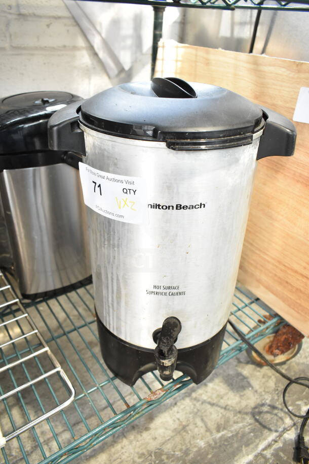 Hamilton Beach beverage holder with spigot, silver and black, label indicates auction item 71, used condition.